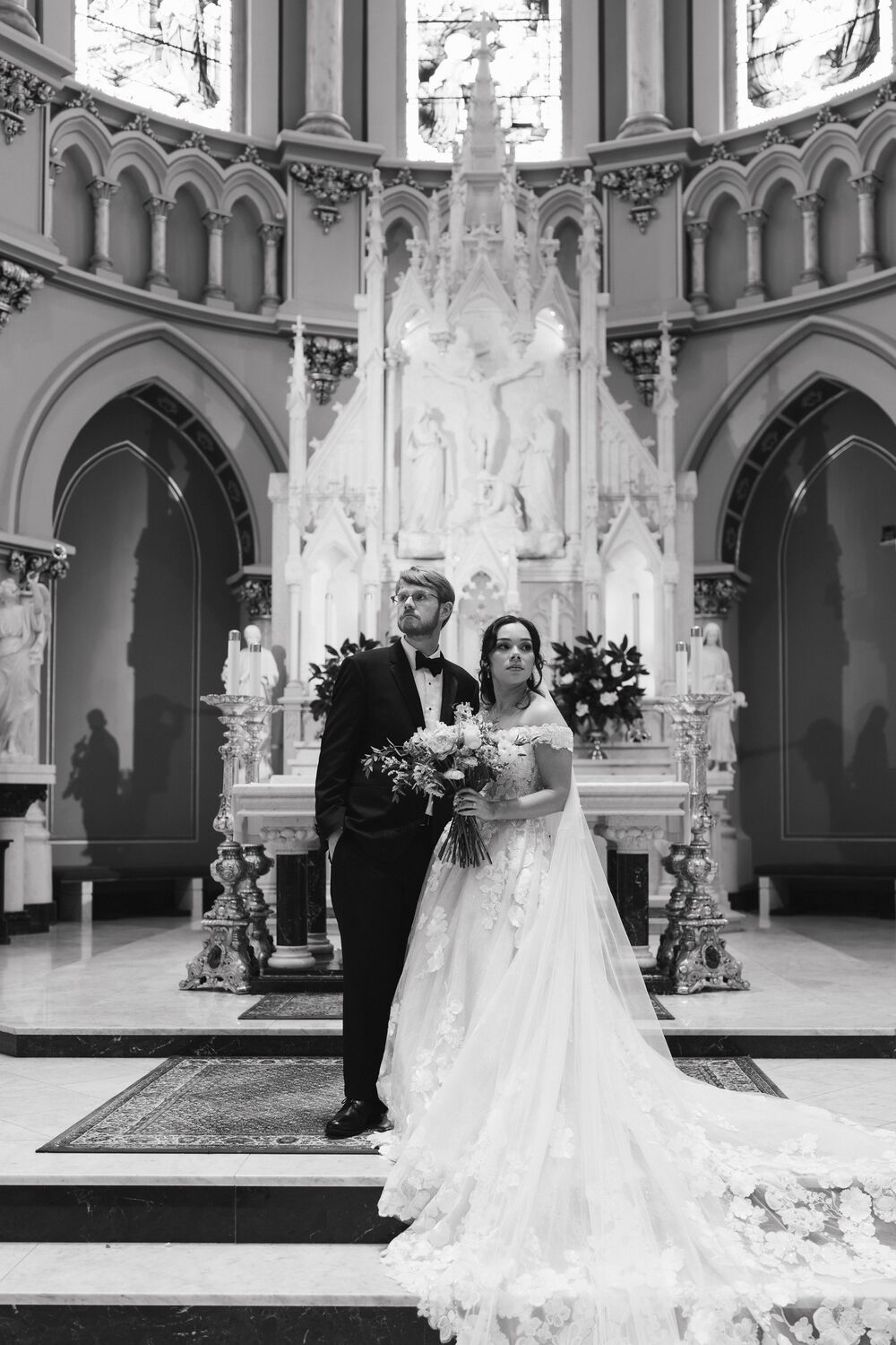 The bride and groom at the altar, in black and white
