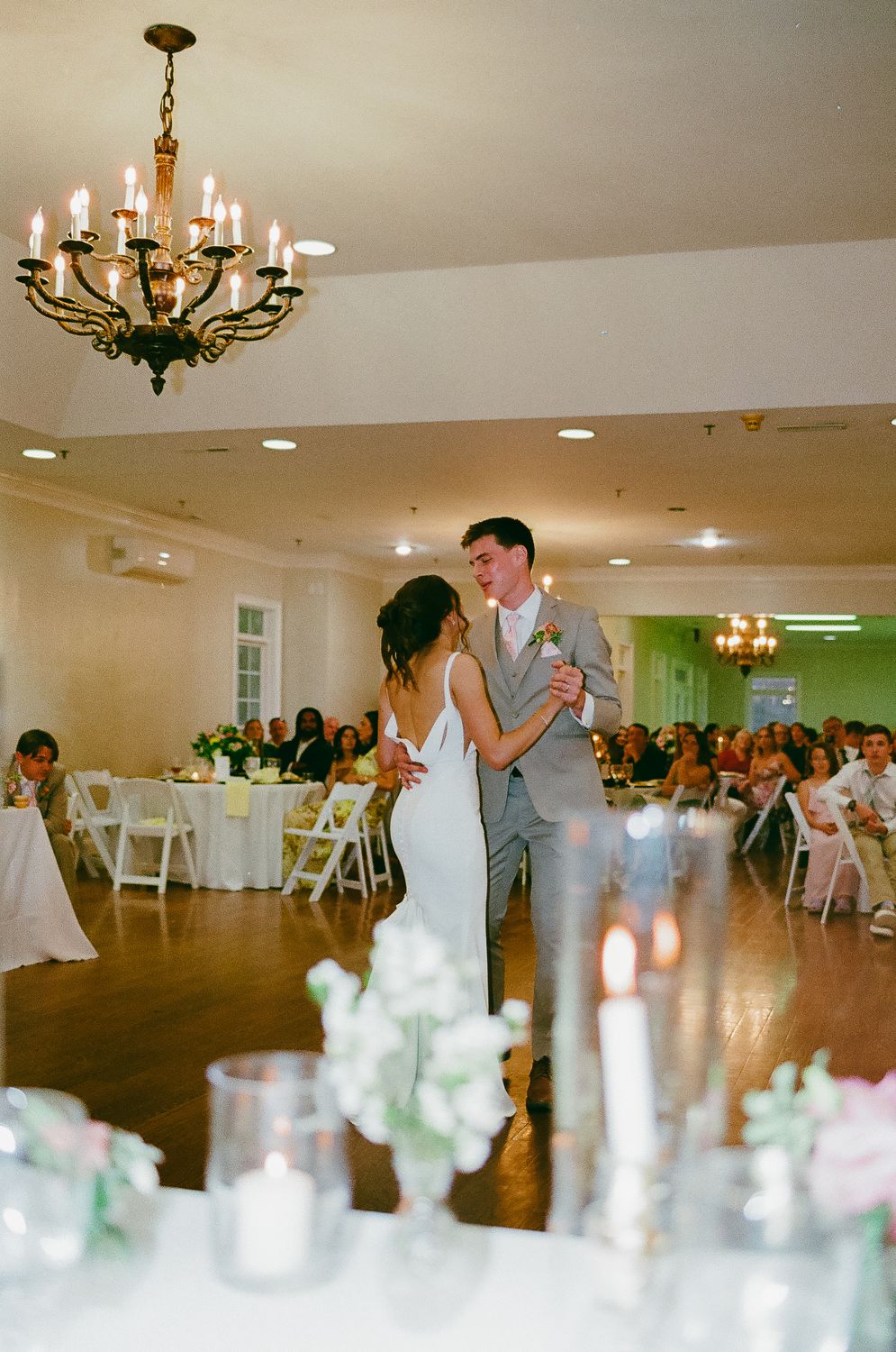 The first dance beneath a chandelier, photographed on film