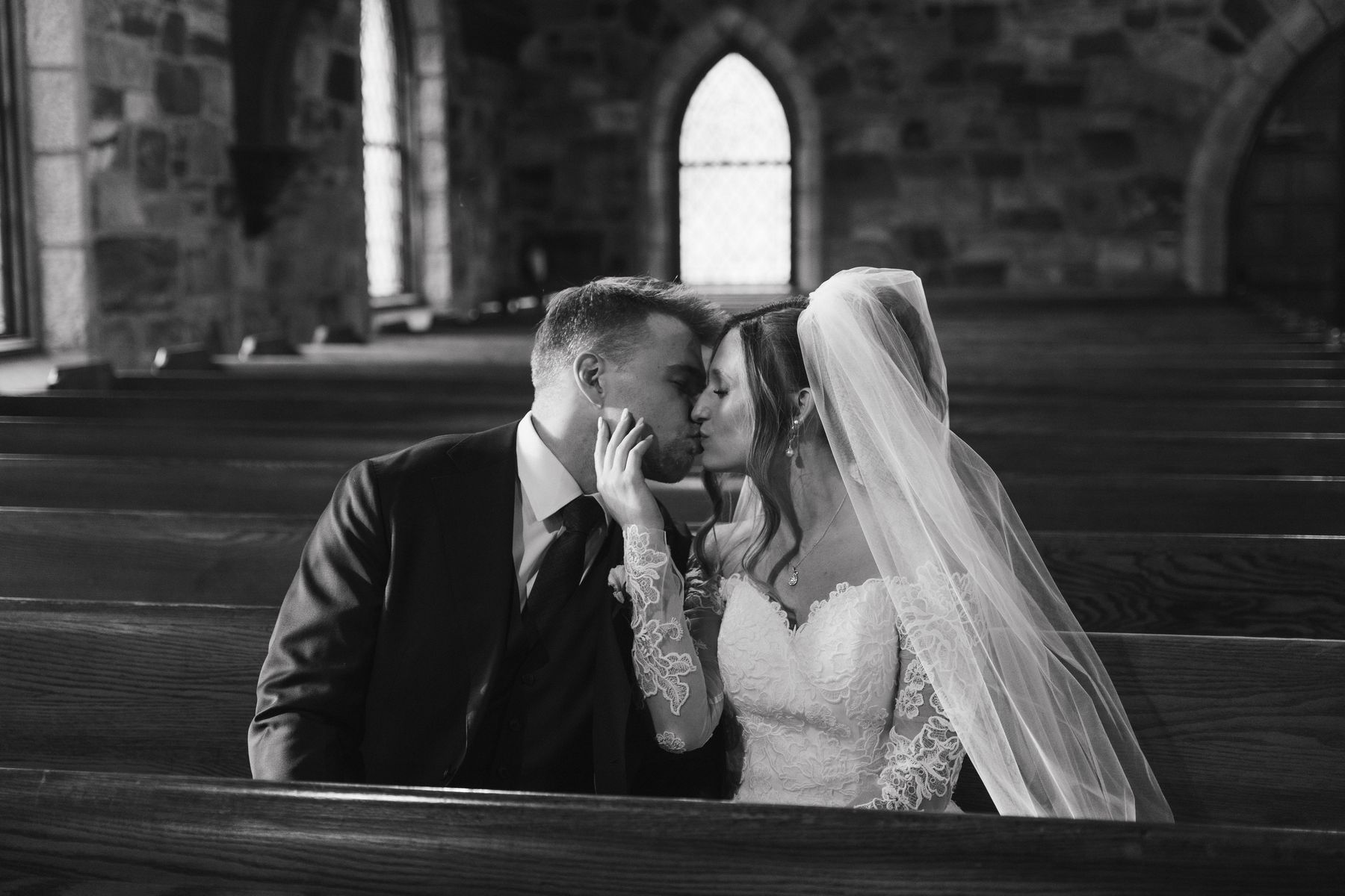 A quiet moment in the chapel pews, in black and white